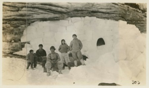 Image: Eskimos [Inughuit] in front of cave